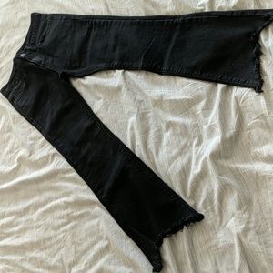 Black jeans with frayed hem